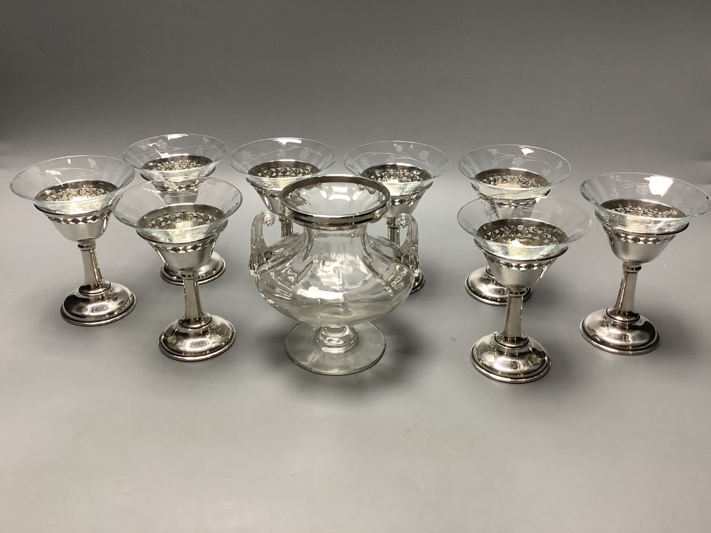 A set of eight Birks sterling mounted glass coupes, height 10.7 cm and a silver mounted two handle glass vase, height 11.9 cm.